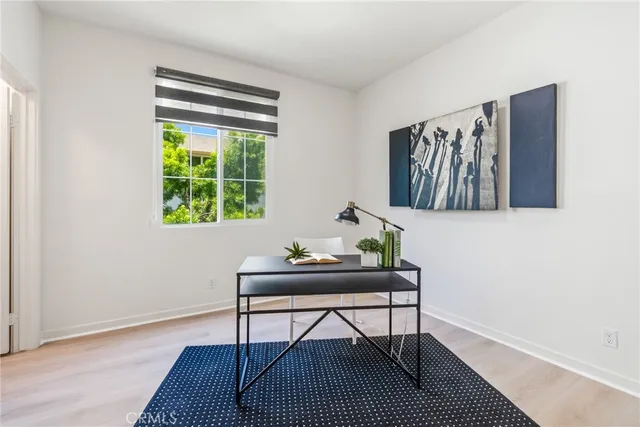 a workspace with furniture and a window