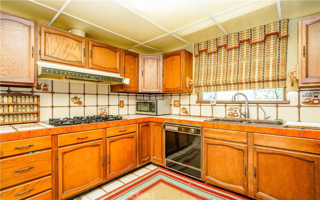 433 Yorbita Road La Puente, CA 91744 - Photo 12 of 40 a view of a kitchen with a sink and cabinets