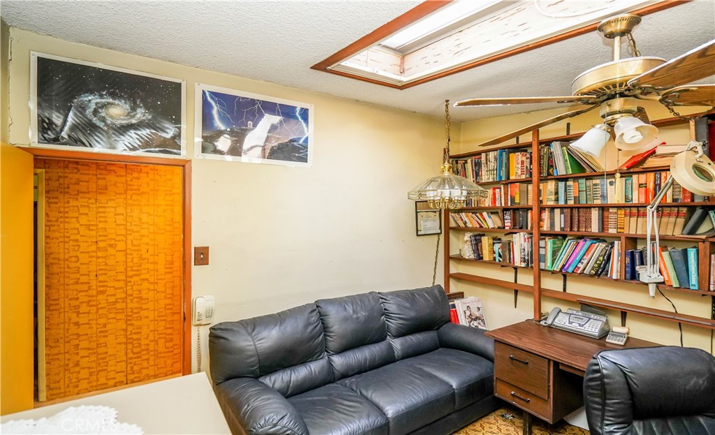 433 Yorbita Road La Puente, CA 91744 - Photo 31 of 40 a bedroom with furniture and a book shelf