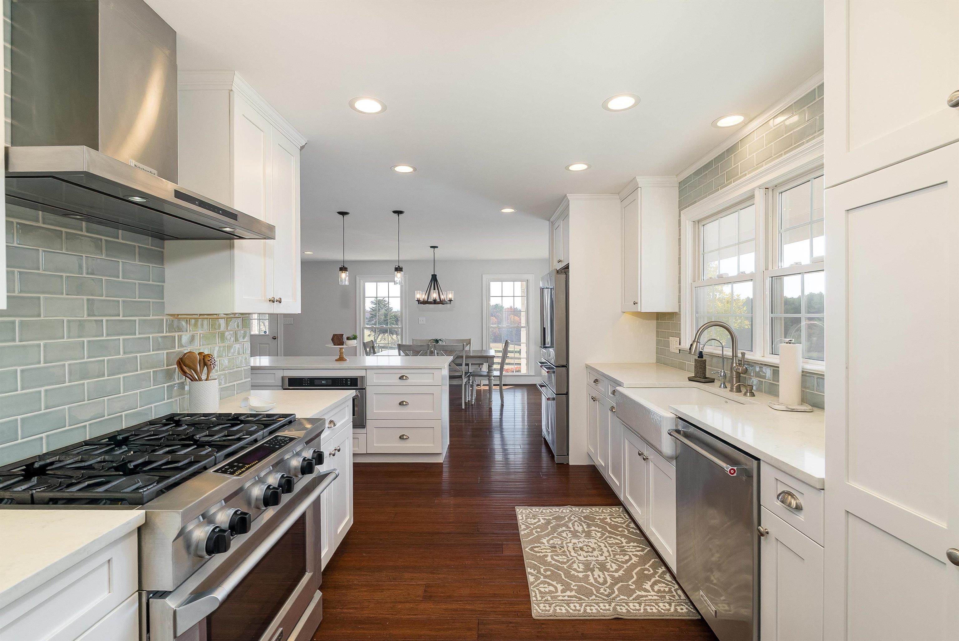 746 Christians Creek Road Staunton, VA 24401 - Photo 16 of 60 a kitchen with white cabinets and appliances