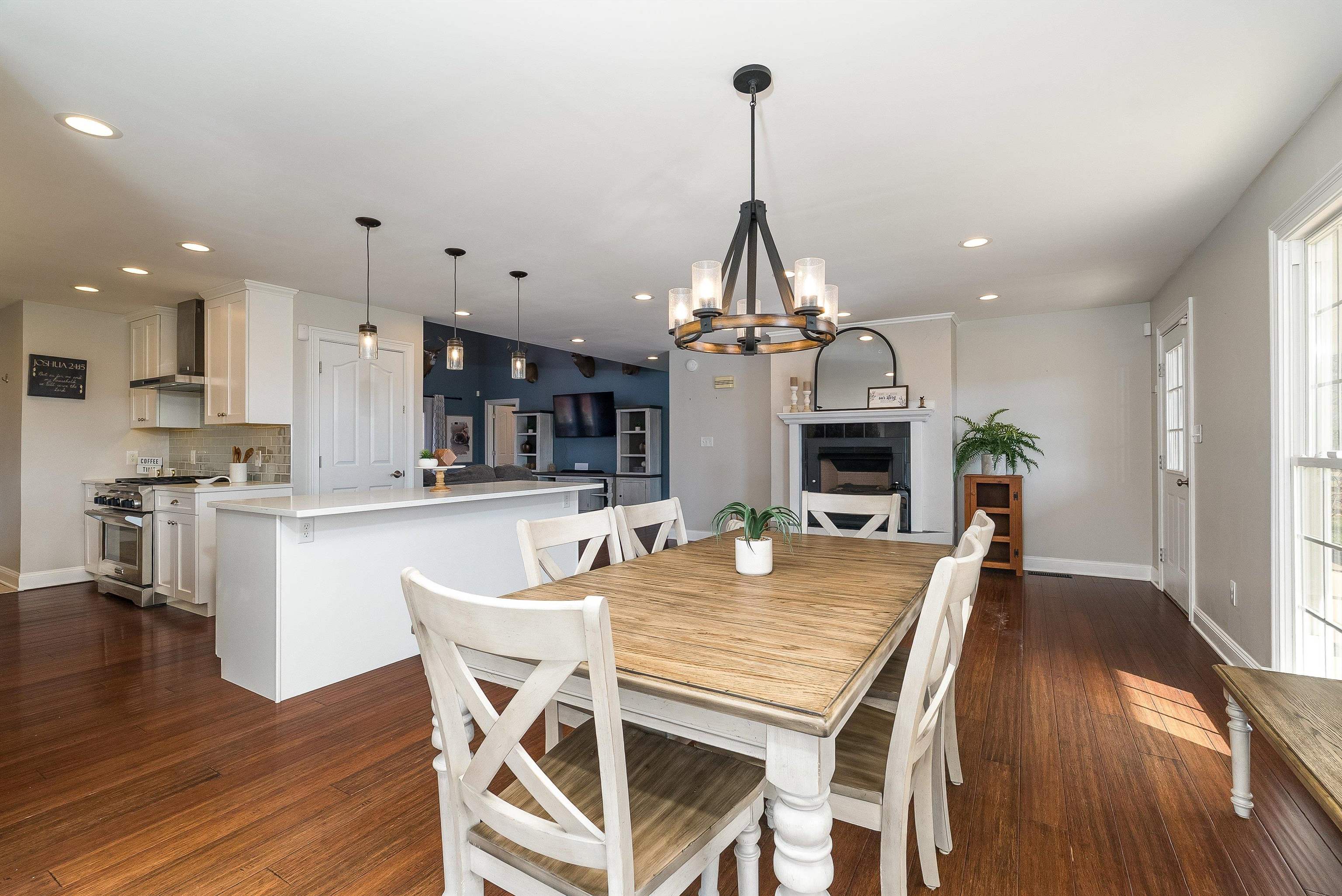 746 Christians Creek Road Staunton, VA 24401 - Photo 23 of 60 a view of a dining room and livingroom with furniture wooden floor a chandelier