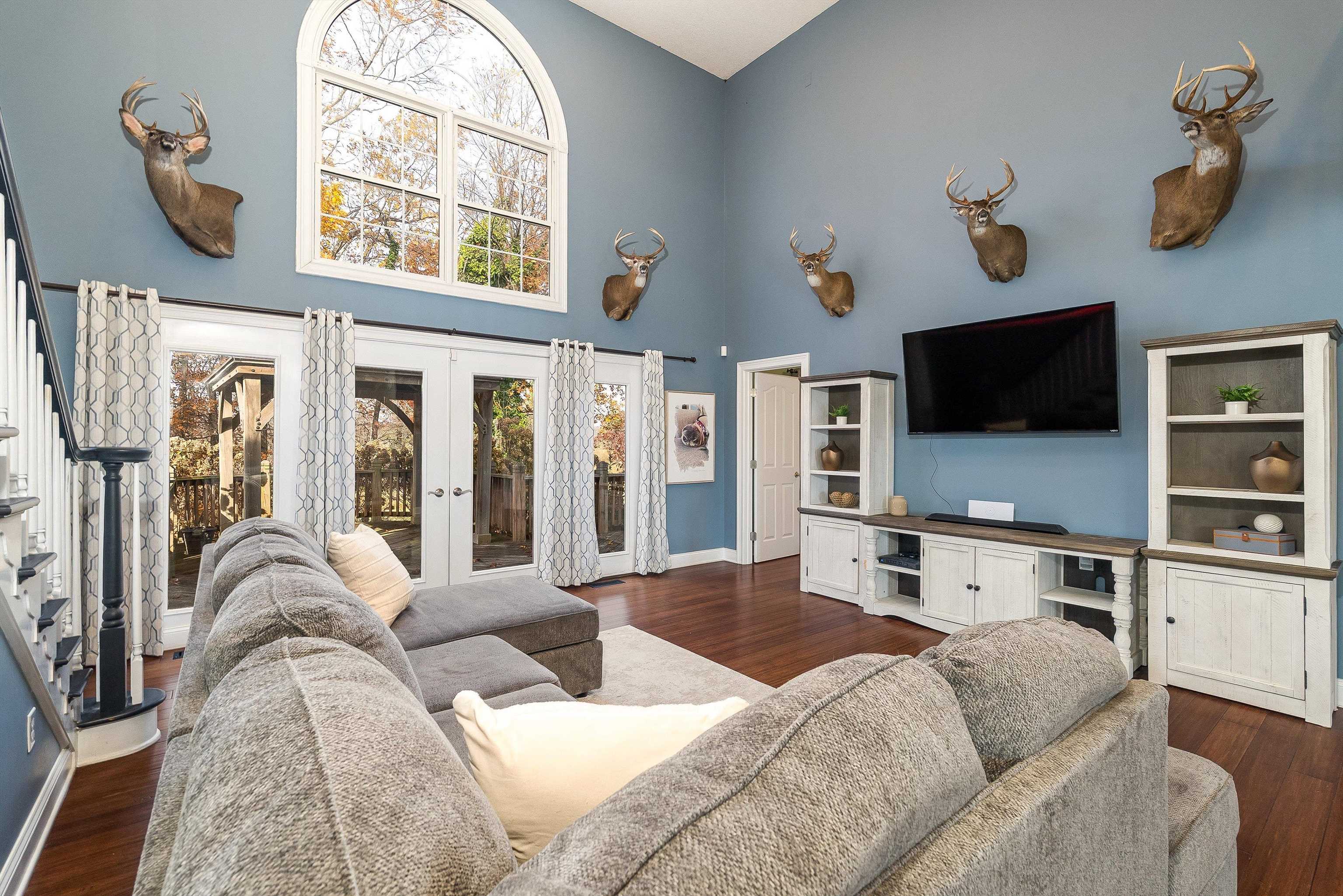 746 Christians Creek Road Staunton, VA 24401 - Photo 26 of 60 a living room with furniture a flat screen tv and a large window
