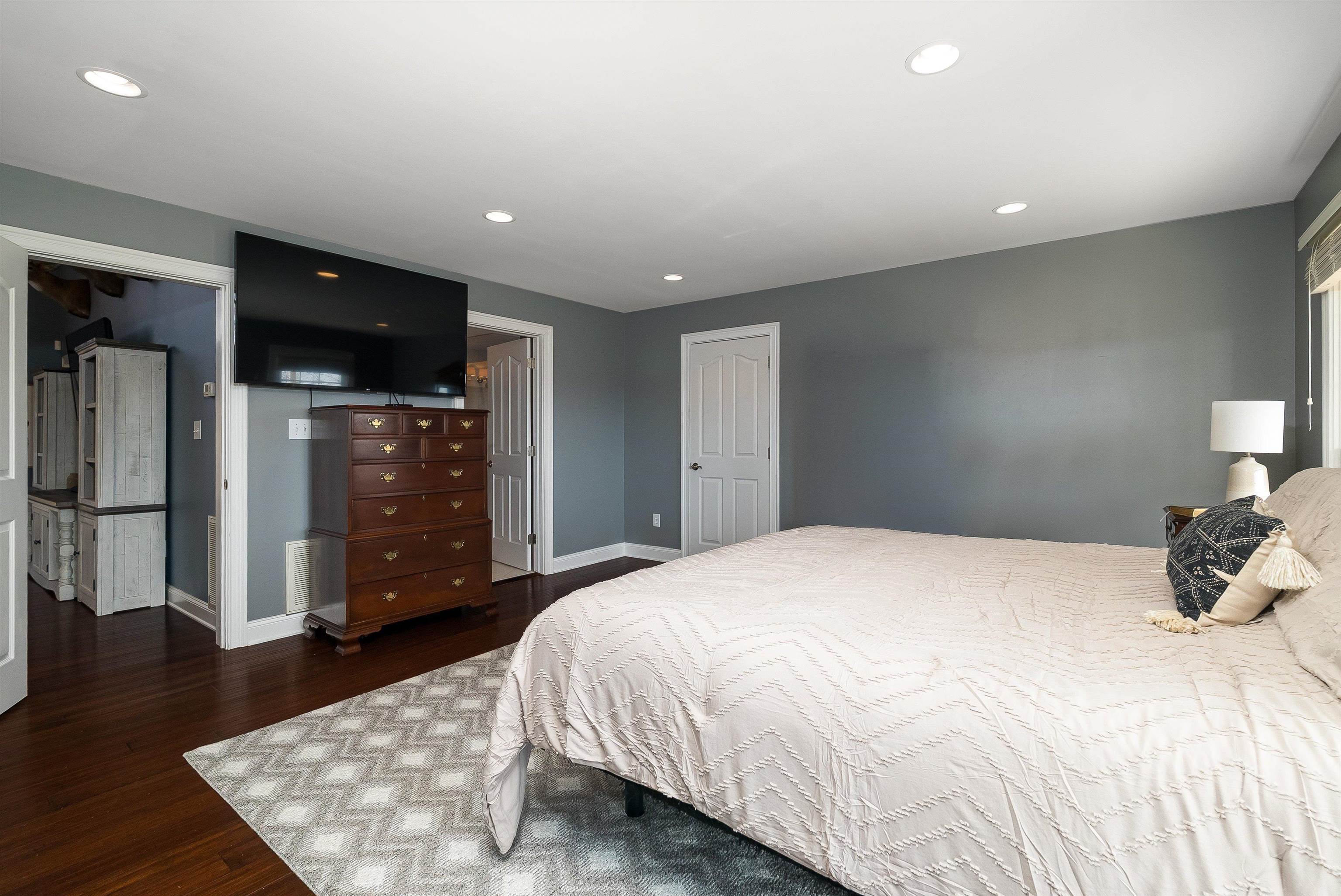 746 Christians Creek Road Staunton, VA 24401 - Photo 29 of 60 a spacious bedroom with a bed and wooden floor