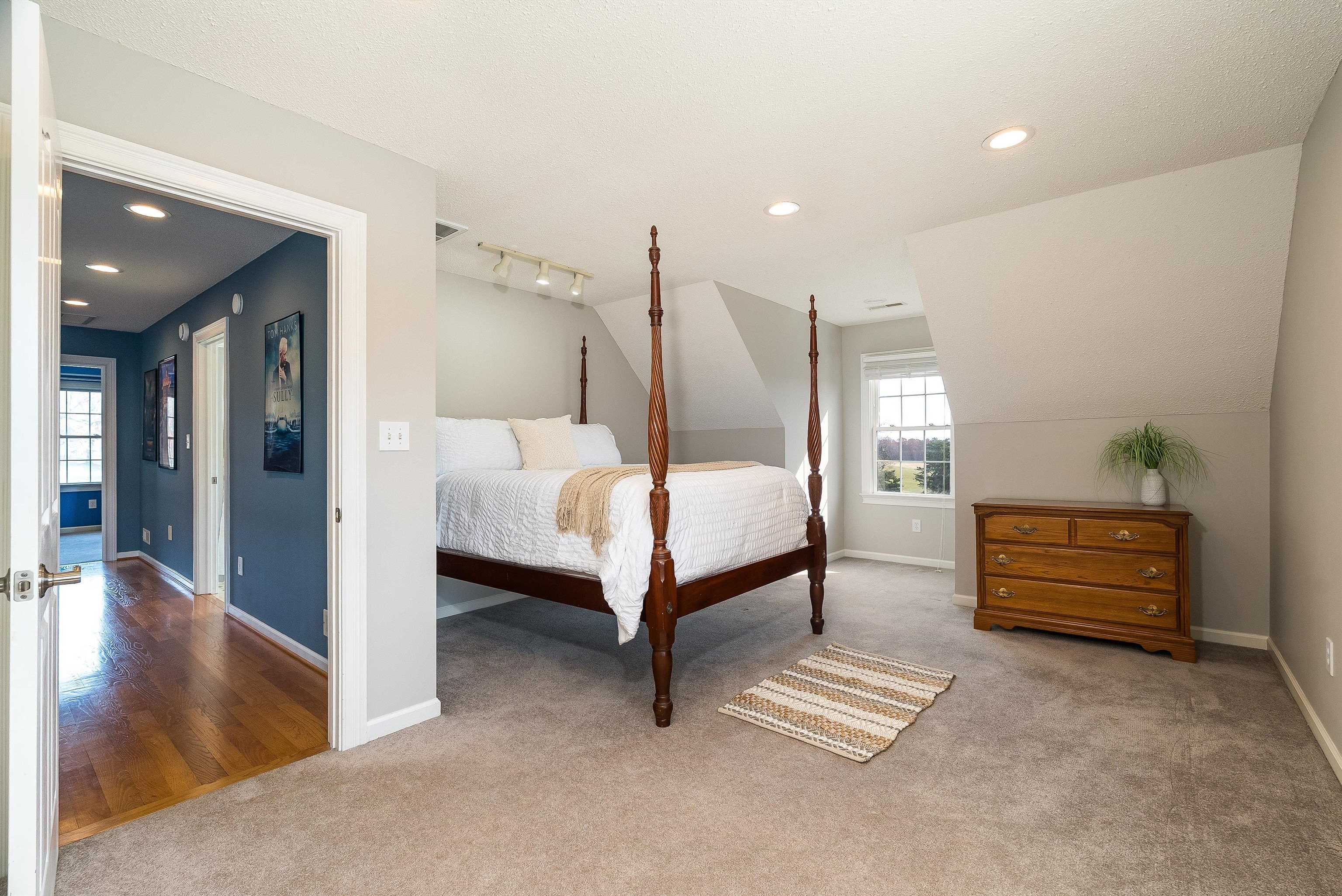 746 Christians Creek Road Staunton, VA 24401 - Photo 39 of 60 a bedroom with furniture and a chandelier