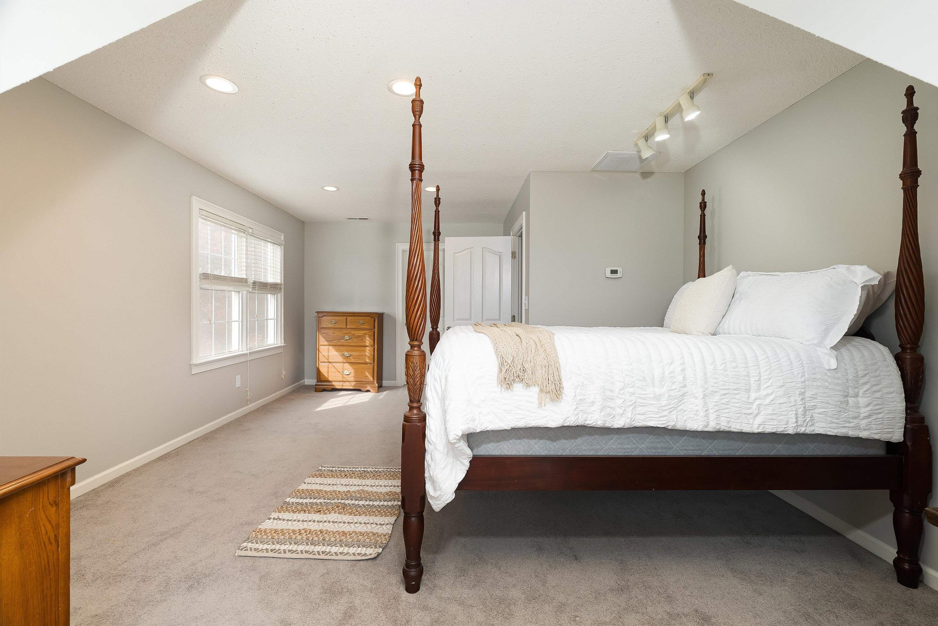 746 Christians Creek Road Staunton, VA 24401 - Photo 41 of 60 a bedroom with a bed a table and painting