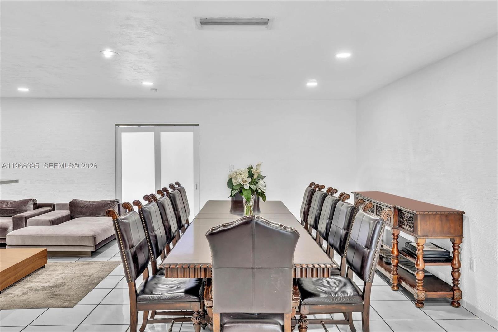 9524 Byron Avenue Surfside, FL 33154 - Photo 23 of 53 a view of a dining room with furniture