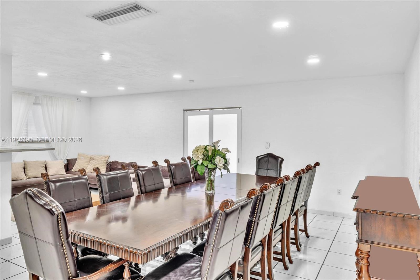 9524 Byron Avenue Surfside, FL 33154 - Photo 24 of 53 a view of a dining room with furniture