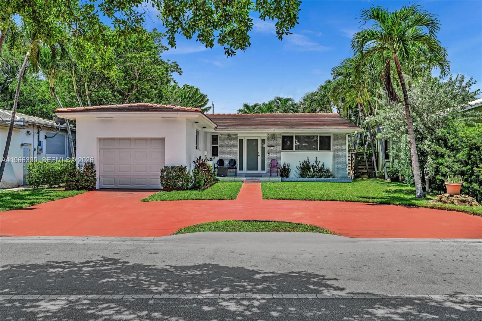 9524 Byron Avenue Surfside, FL 33154 - Photo 4 of 53 a view of outdoor space yard and front view of house