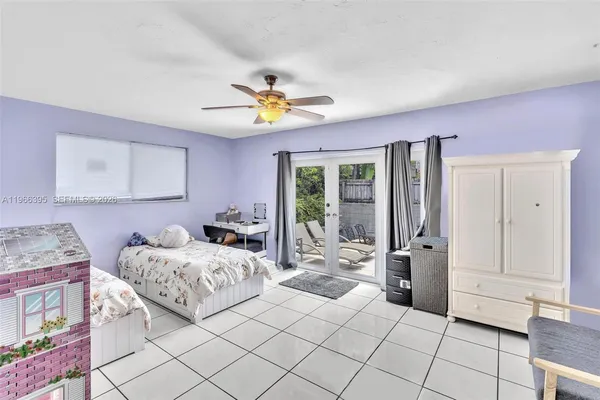 a view of a swimming pool with a patio and a garden