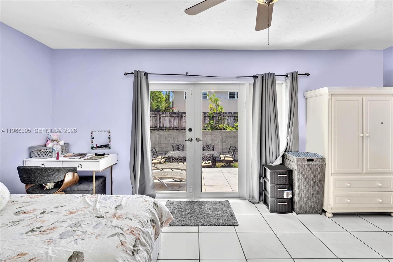 9524 Byron Avenue Surfside, FL 33154 - Photo 47 of 53 a bed room with a bed and a table