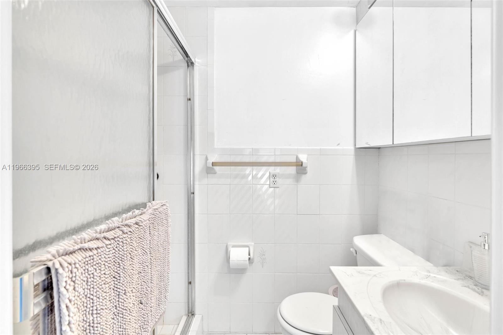 9524 Byron Avenue Surfside, FL 33154 - Photo 53 of 53 a bathroom with a toilet and a sink