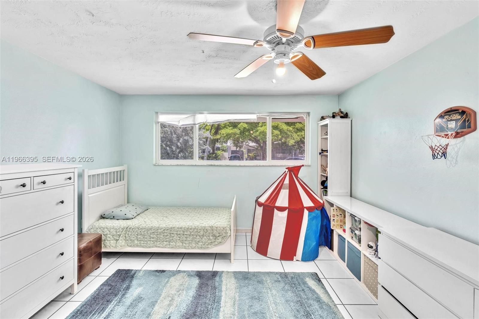 9524 Byron Avenue Surfside, FL 33154 - Photo 8 of 53 a bedroom with a bed and a dresser
