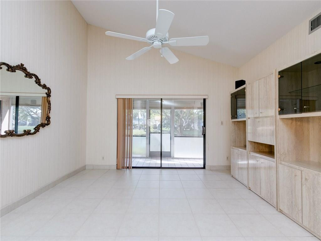 679 Racquet Club Road, Unit 4 Weston, FL 33326 - Photo 14 of 35 a view of a kitchen with wooden floor and a window