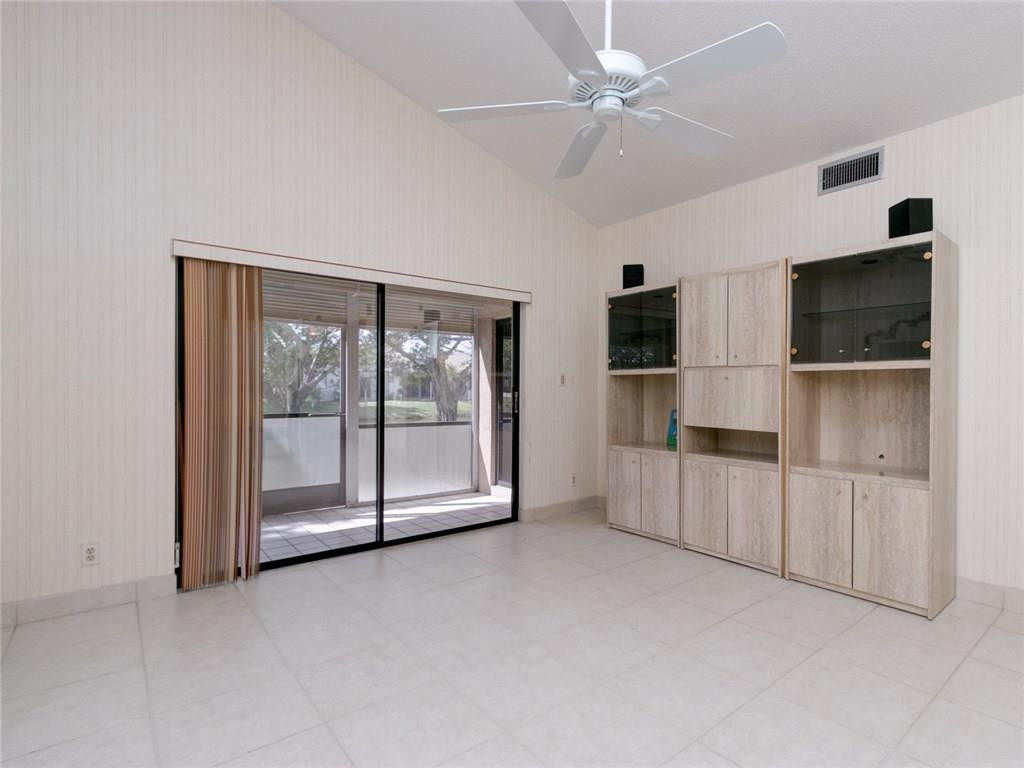 679 Racquet Club Road, Unit 4 Weston, FL 33326 - Photo 15 of 35 a view of a livingroom with an empty space and a fireplace