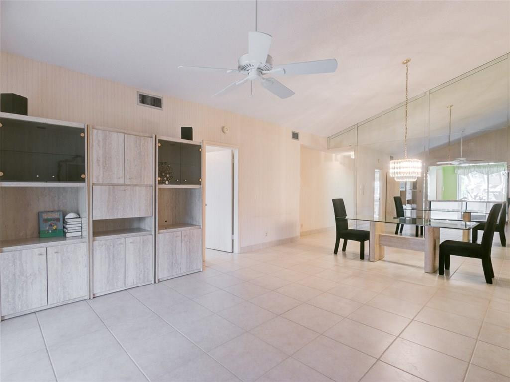 679 Racquet Club Road, Unit 4 Weston, FL 33326 - Photo 16 of 35 a view of kitchen with furniture and refrigerator