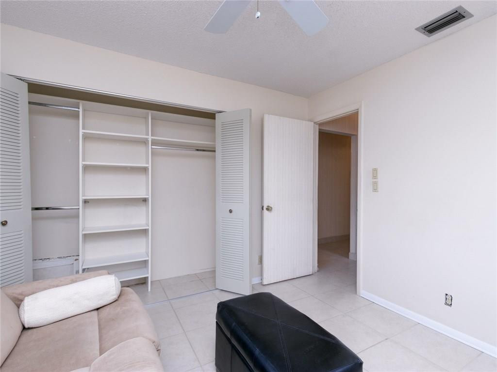 679 Racquet Club Road, Unit 4 Weston, FL 33326 - Photo 25 of 35 a living room with furniture and a closet