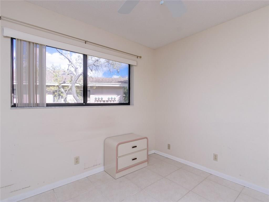 679 Racquet Club Road, Unit 4 Weston, FL 33326 - Photo 28 of 35 an empty room with a large window