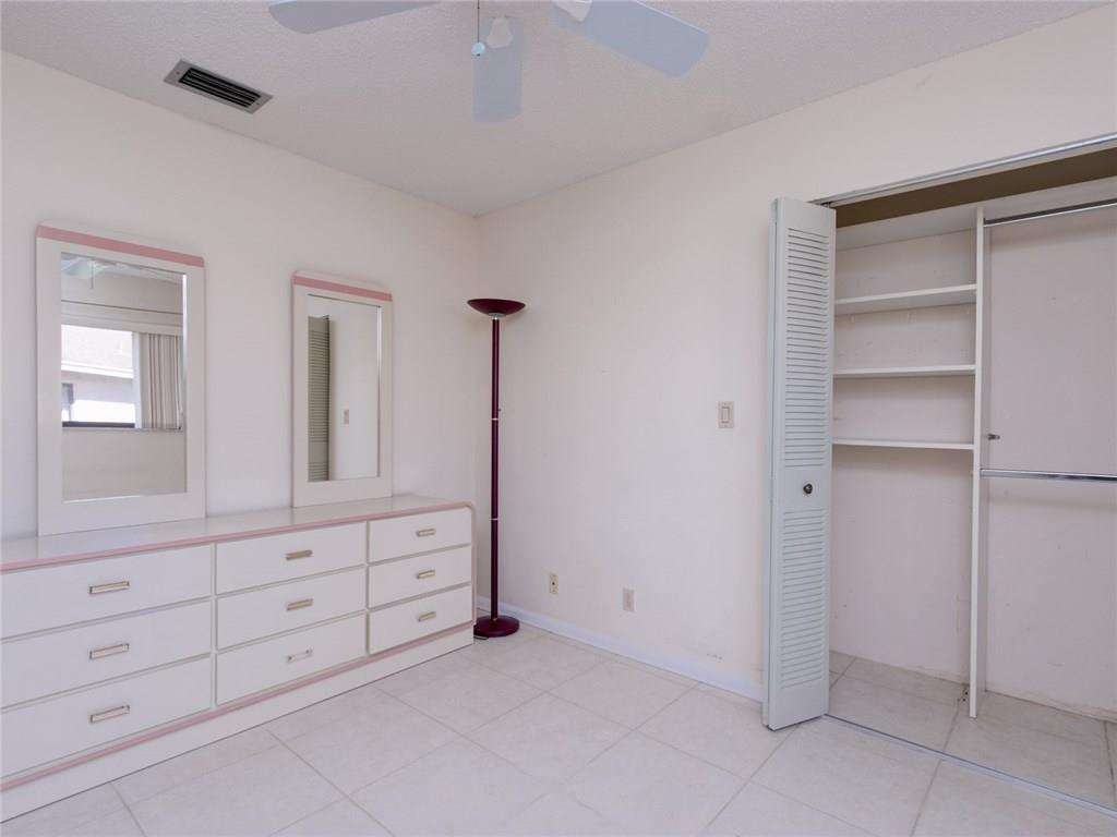 679 Racquet Club Road, Unit 4 Weston, FL 33326 - Photo 29 of 35 a view of an empty room with cabinet and mirror