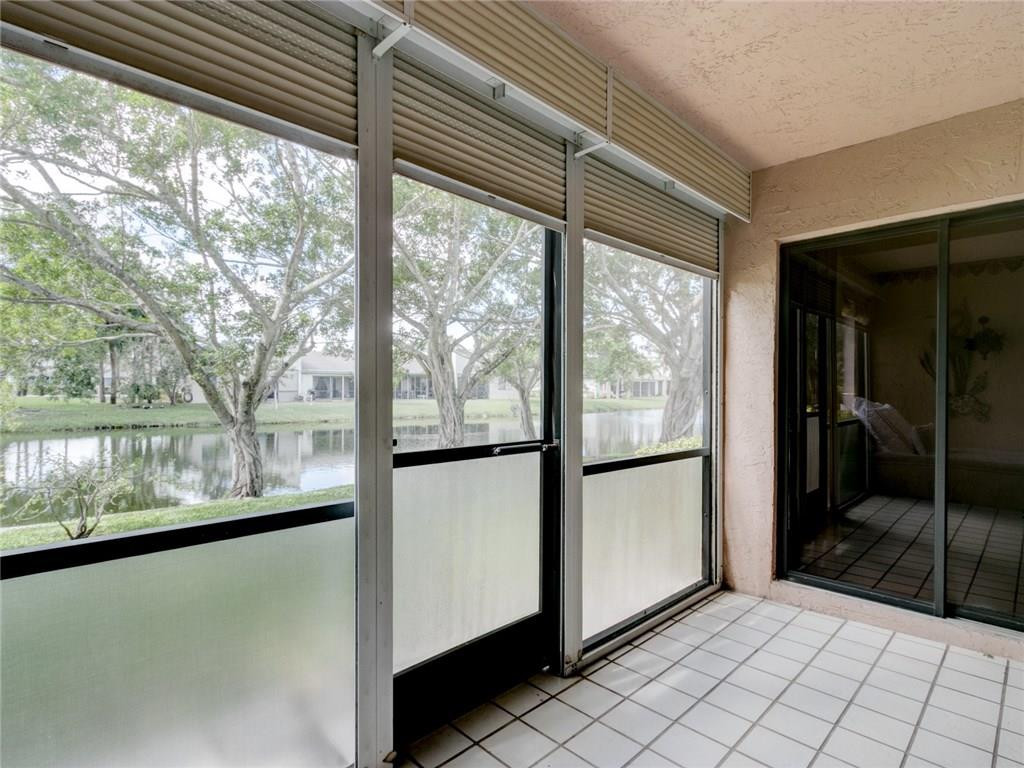 679 Racquet Club Road, Unit 4 Weston, FL 33326 - Photo 31 of 35 a view of a glass door with a yard from a window