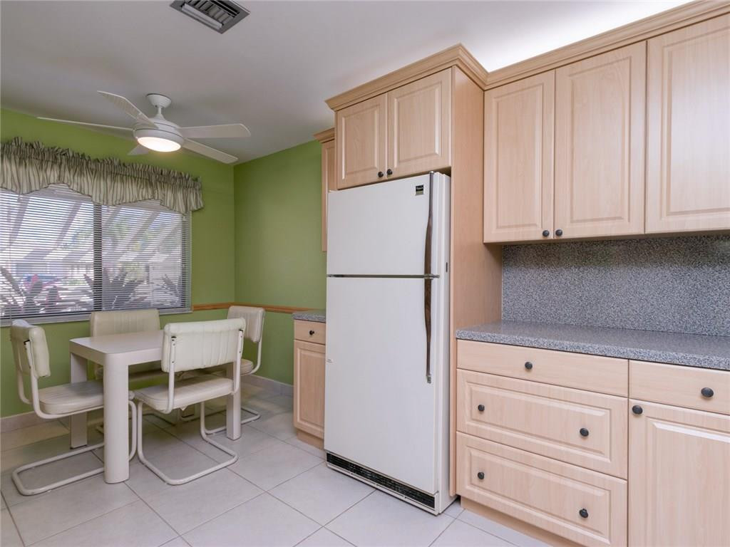 679 Racquet Club Road, Unit 4 Weston, FL 33326 - Photo 7 of 35 a white refrigerator freezer sitting inside of a kitchen