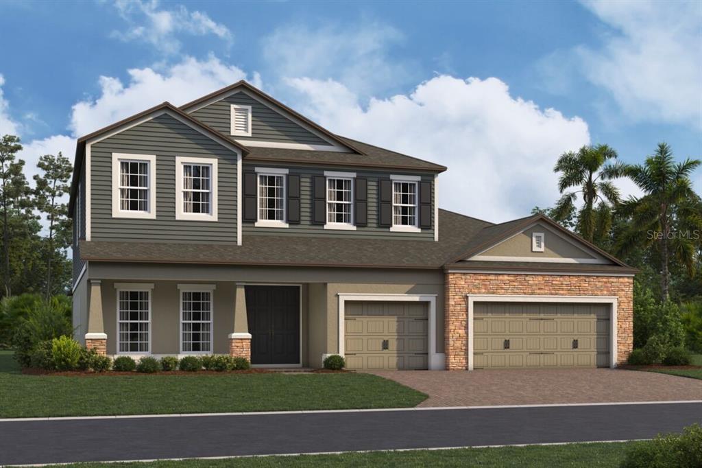 3850 Wolves Crk Place Apopka, FL 32712 - Photo 8 of 11 a front view of a house with a garden