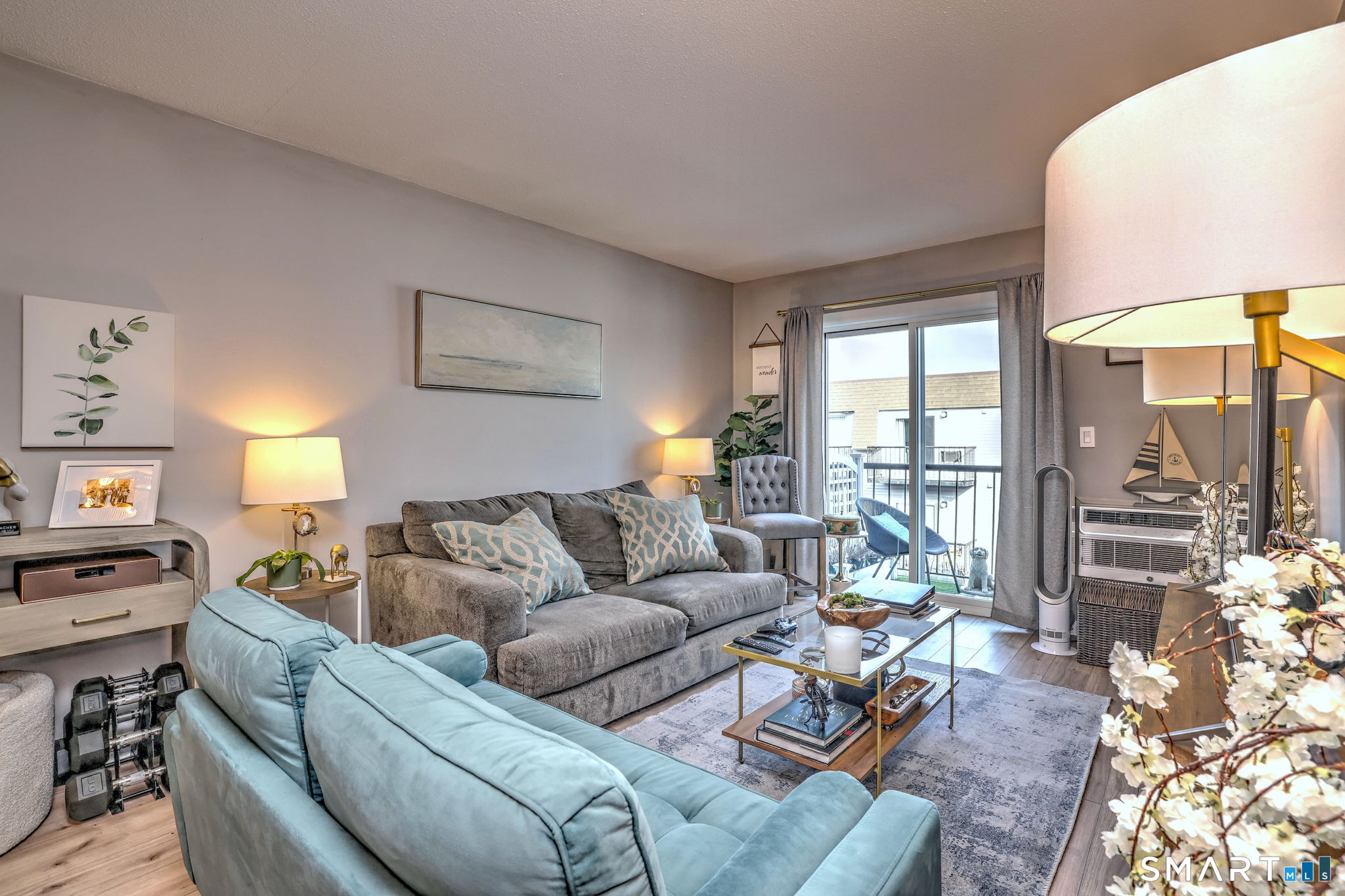 155 Short Beach Road, Unit 304 Stratford, CT 06615 - Photo 11 of 37 a living room with furniture and a large window