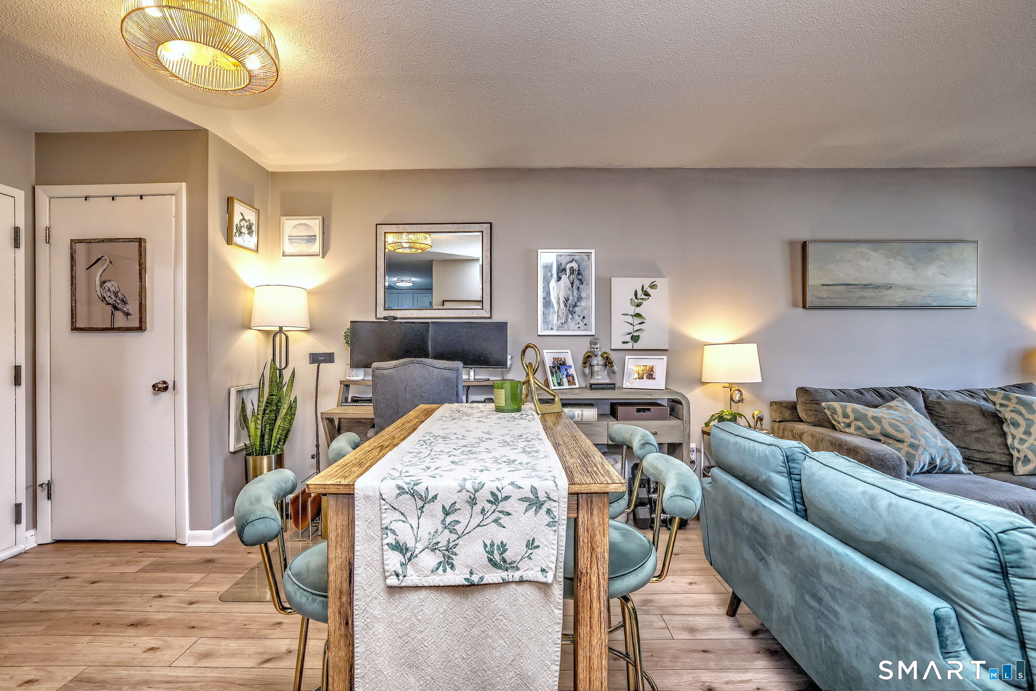 155 Short Beach Road, Unit 304 Stratford, CT 06615 - Photo 23 of 37 a living room with furniture and a flat screen tv