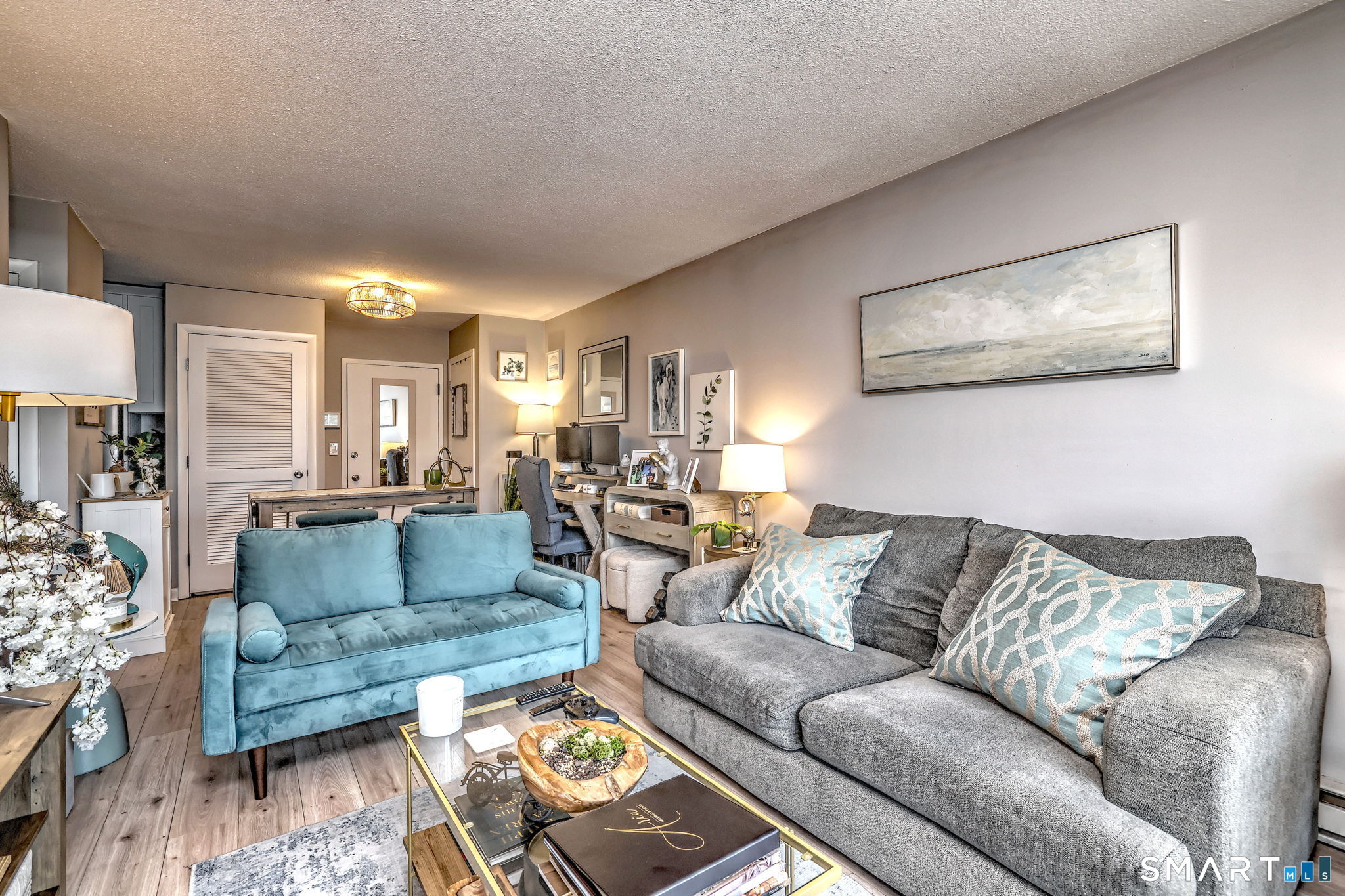 155 Short Beach Road, Unit 304 Stratford, CT 06615 - Photo 27 of 37 a living room with furniture and a couch