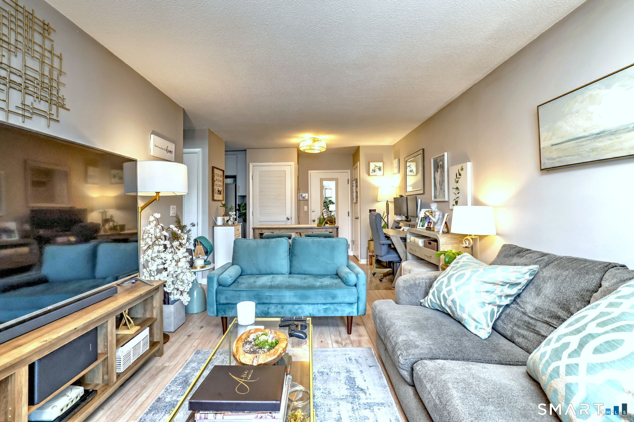 155 Short Beach Road, Unit 304 Stratford, CT 06615 - Photo 33 of 37 a living room with furniture and a flat screen tv