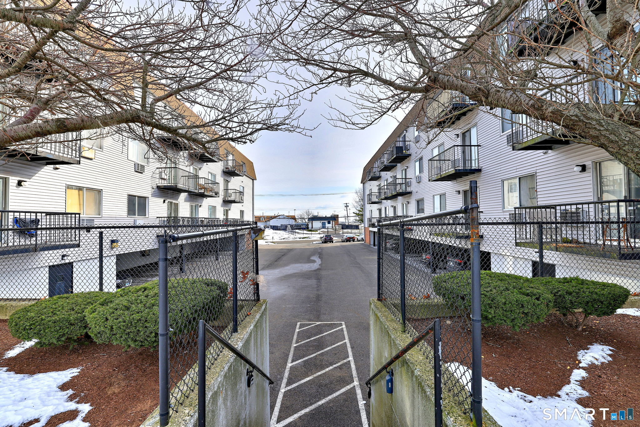 155 Short Beach Road, Unit 304 Stratford, CT 06615 - Photo 6 of 37 a view of a patio with table and chairs and potted plants