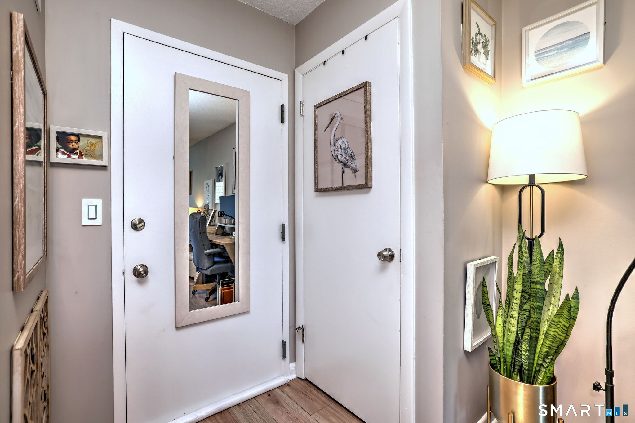 155 Short Beach Road, Unit 304 Stratford, CT 06615 - Photo 8 of 37 a view of an entryway with wooden floor