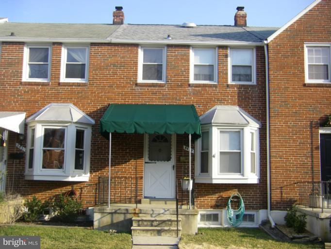 8429 Pleasant Plains Road Towson, MD 21286 - Photo 1 of 17 a front view of a house with a yard
