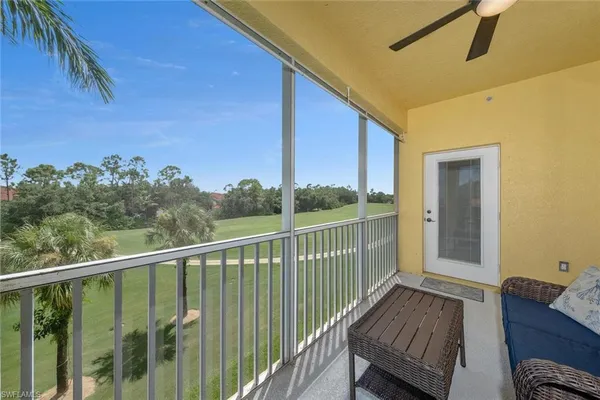a view of balcony with furniture