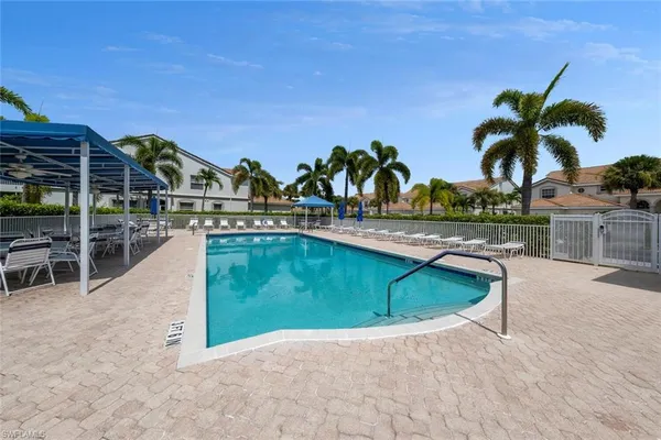 swimming pool view with a garden space