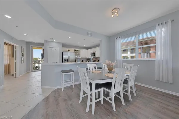 a dining room with furniture and window