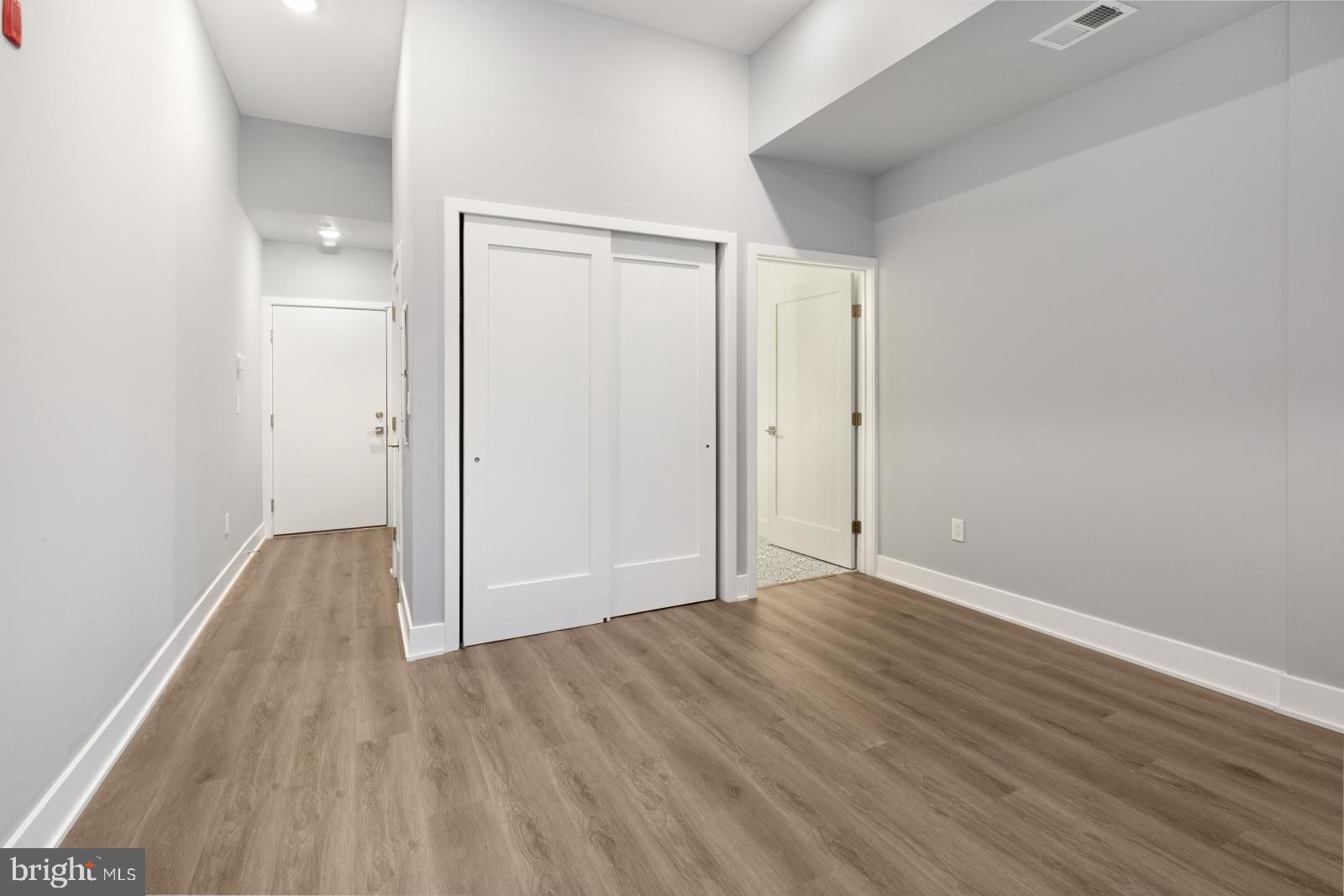 2119 North Front Street, Unit 101 Philadelphia, PA 19122 - Photo 13 of 23 a view of an empty room and wooden floor