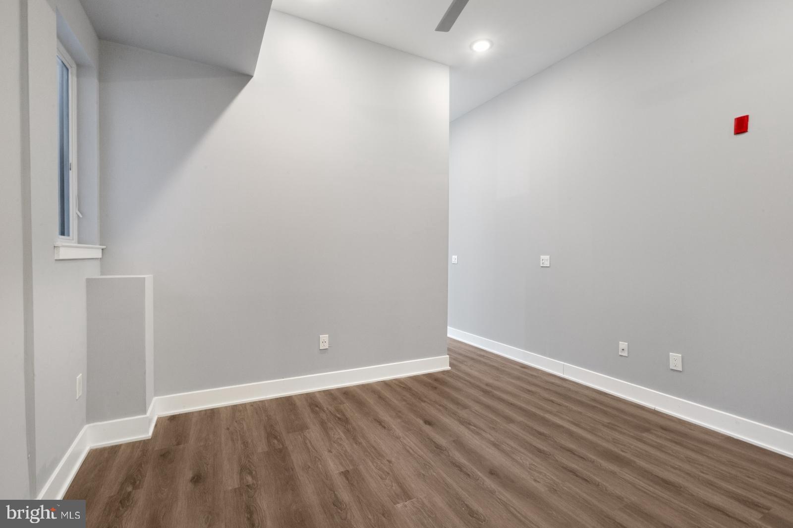 2119 North Front Street, Unit 101 Philadelphia, PA 19122 - Photo 15 of 23 a view of an empty room with wooden floor and closet