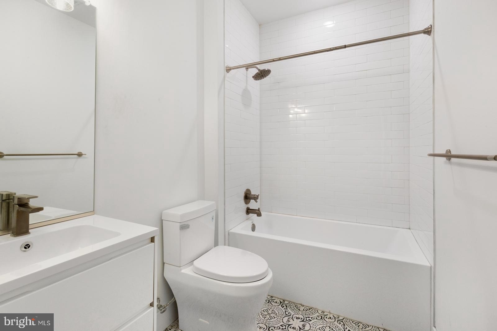 2119 North Front Street, Unit 101 Philadelphia, PA 19122 - Photo 16 of 23 a bathroom with a sink toilet and shower