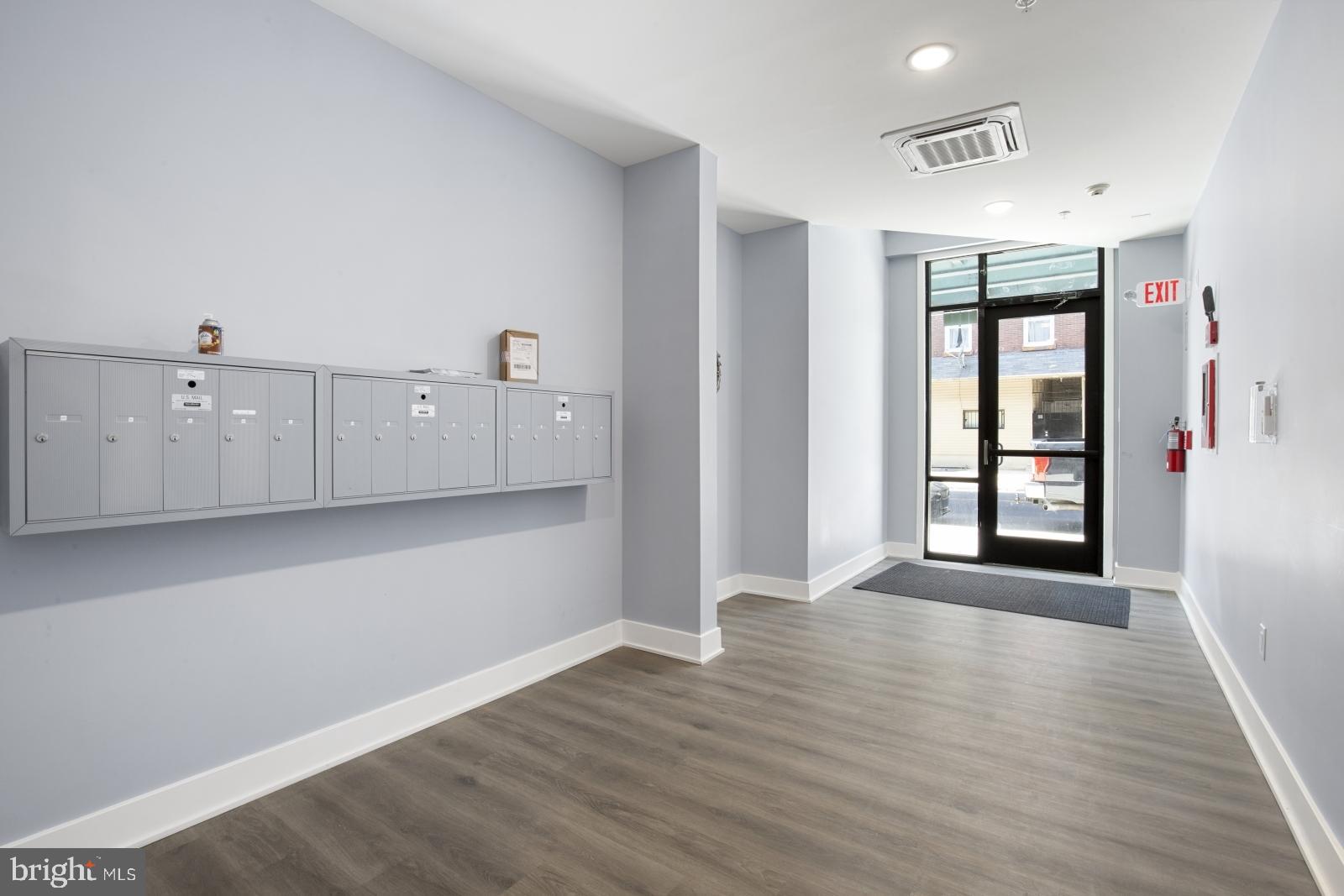2119 North Front Street, Unit 101 Philadelphia, PA 19122 - Photo 20 of 23 a view of an empty room with window and wooden floor