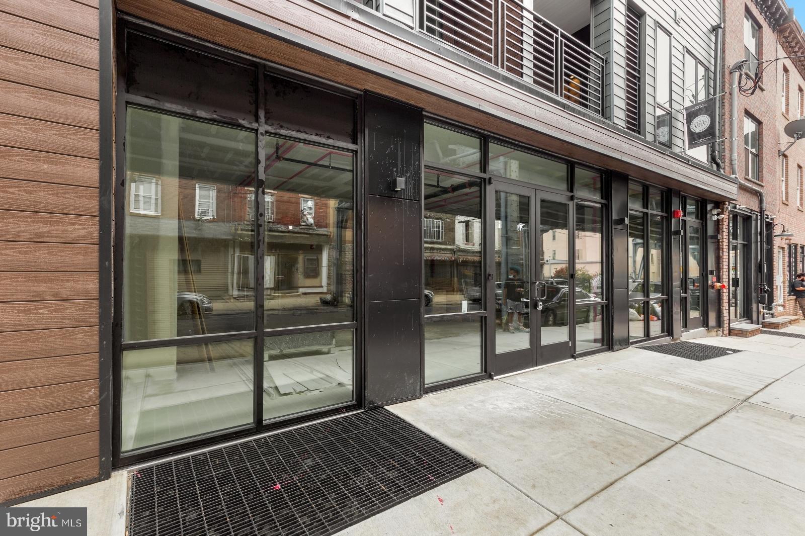 2119 North Front Street, Unit 101 Philadelphia, PA 19122 - Photo 21 of 23 a view of a brick building with a glass door