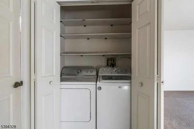 a kitchen with a refrigerator and cabinets
