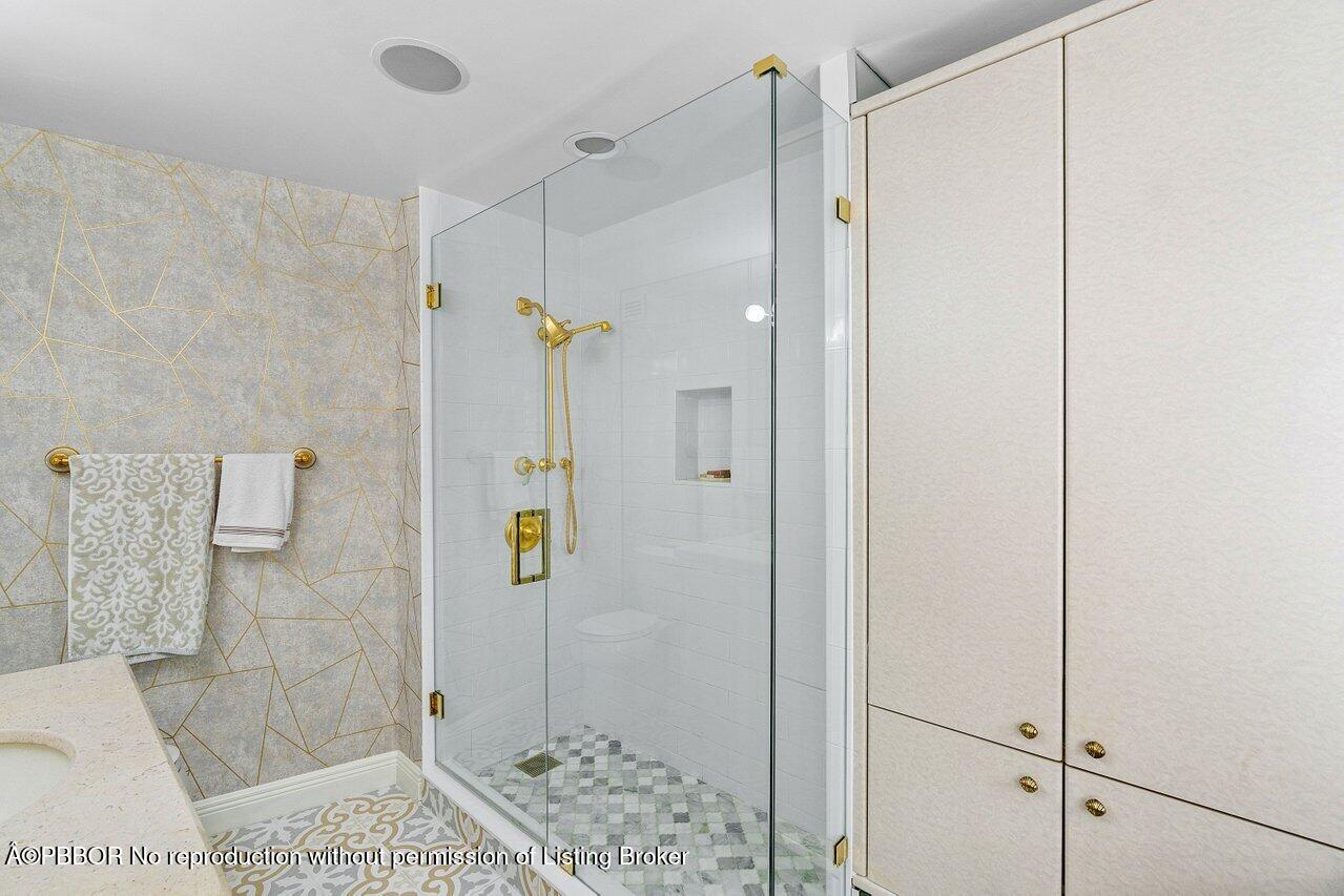 44 Cocoanut Row, Unit 505B Palm Beach, FL 33480 - Photo 12 of 14 a bathroom with a shower and a sink