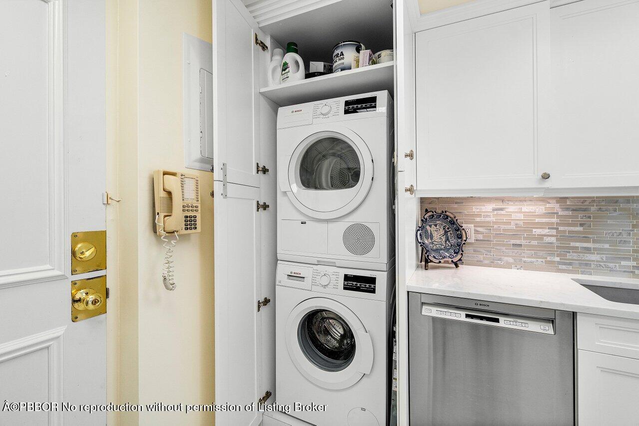 44 Cocoanut Row, Unit 505B Palm Beach, FL 33480 - Photo 13 of 14 a utility room with dryer and washer