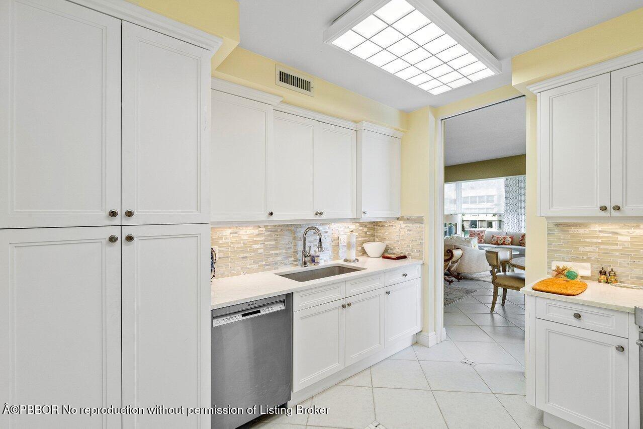 44 Cocoanut Row, Unit 505B Palm Beach, FL 33480 - Photo 6 of 14 a kitchen with a sink cabinets and window