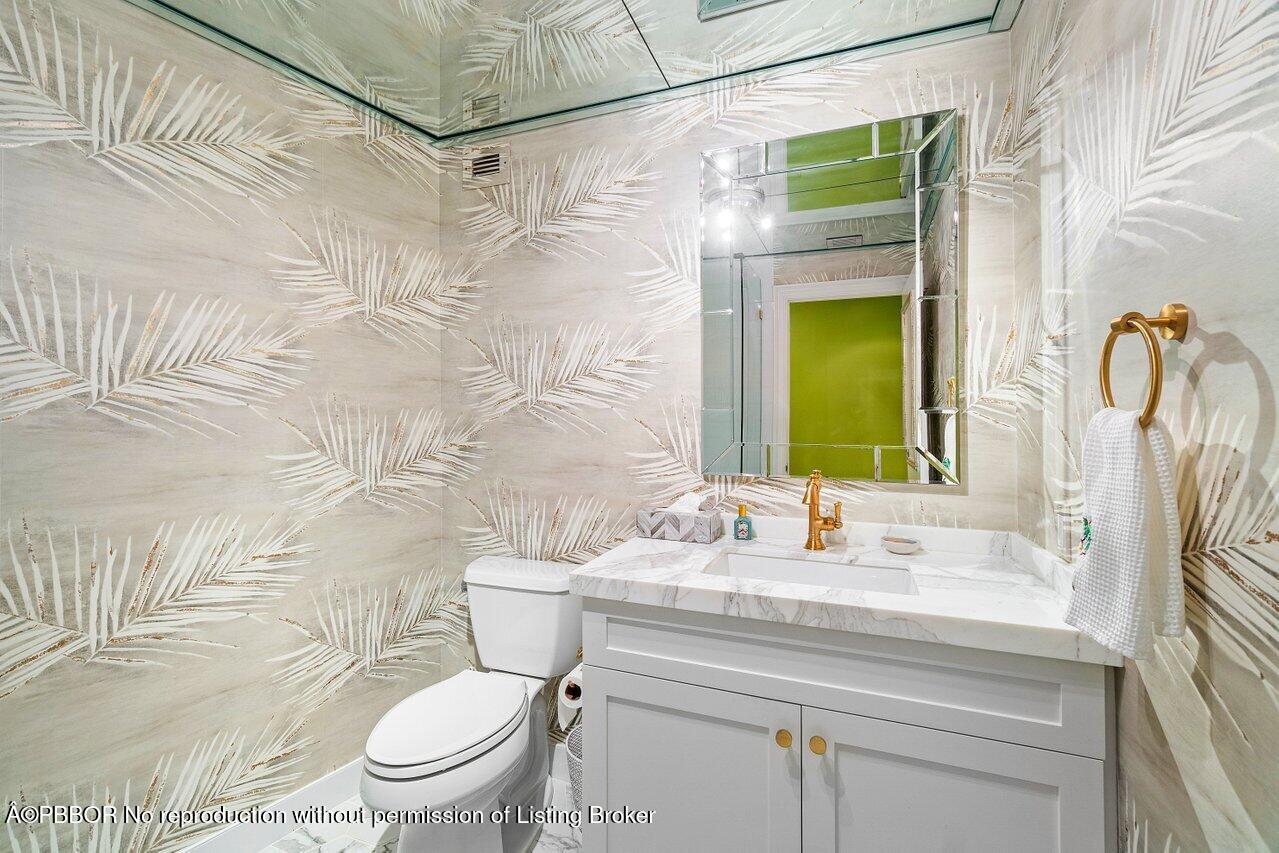 44 Cocoanut Row, Unit 505B Palm Beach, FL 33480 - Photo 8 of 14 a bathroom with a sink toilet and shower