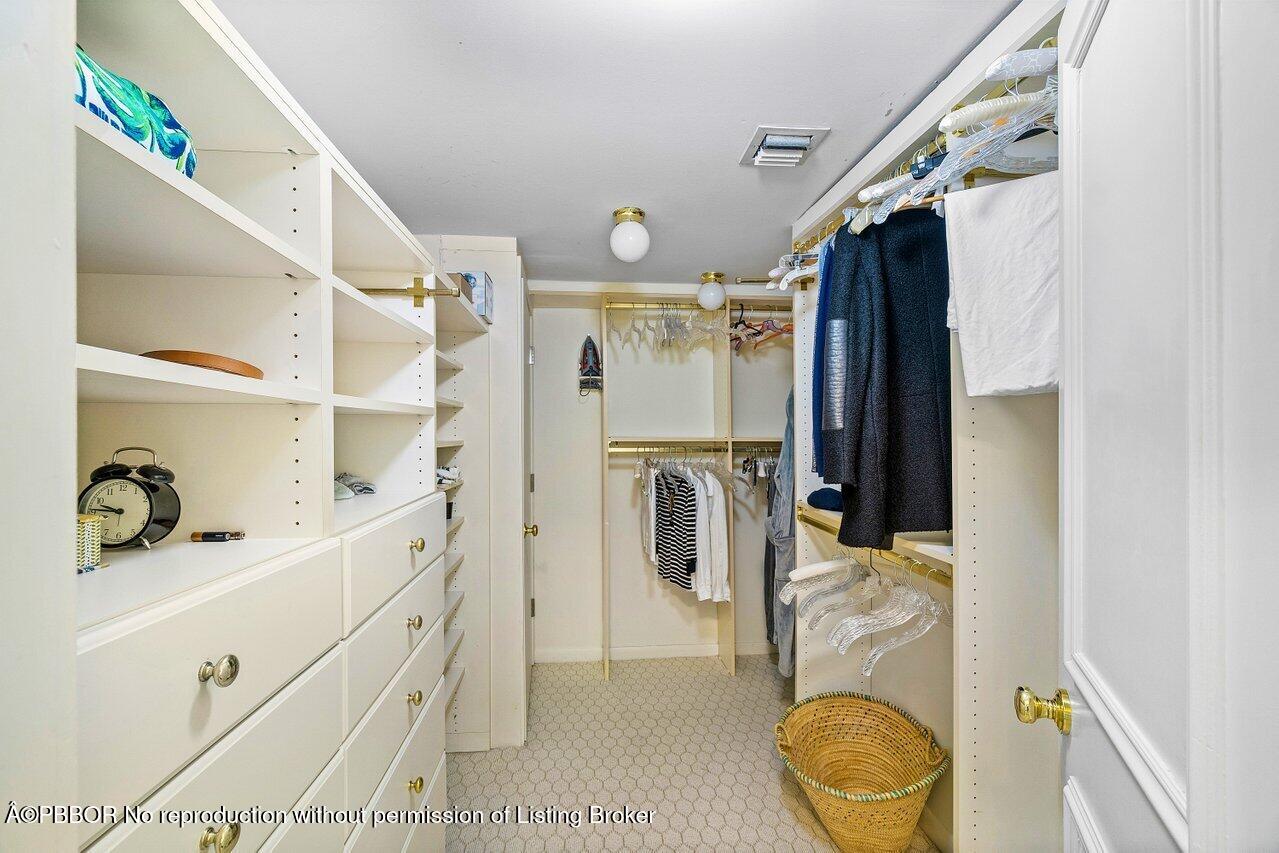 44 Cocoanut Row, Unit 505B Palm Beach, FL 33480 - Photo 10 of 14 a bathroom with a sink a toilet and shower
