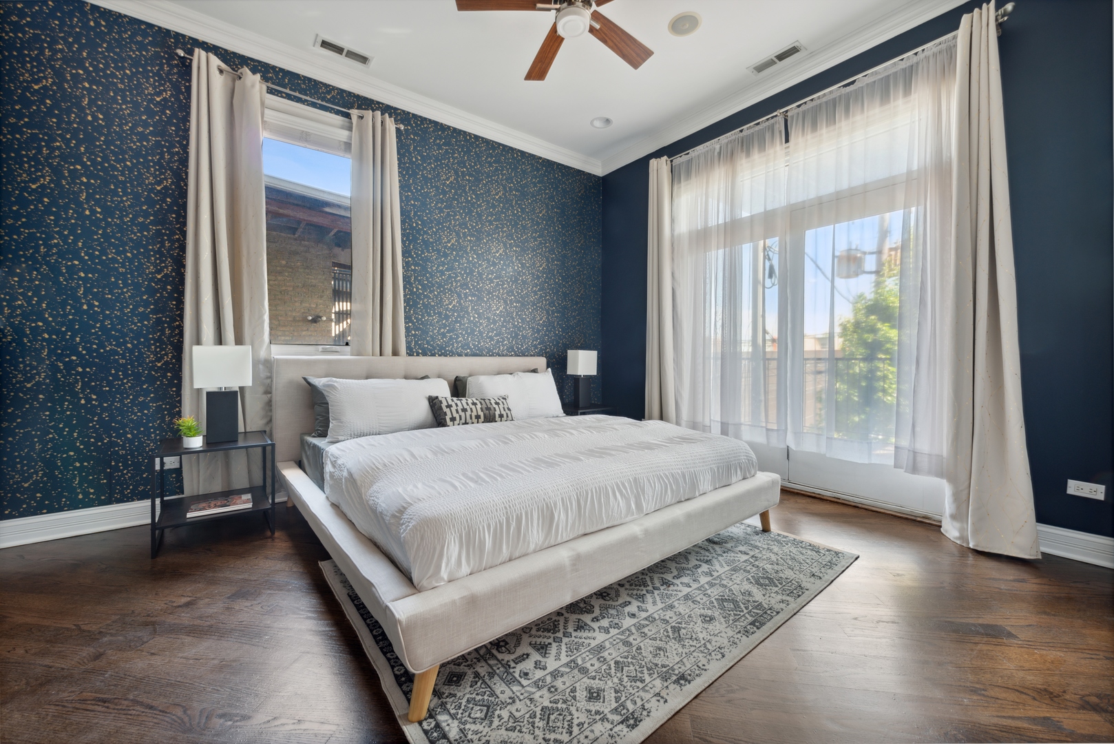 1131 West Addison Street, Unit 2 Chicago, IL 60613 - Photo 12 of 21 a bedroom with a large bed and a large window