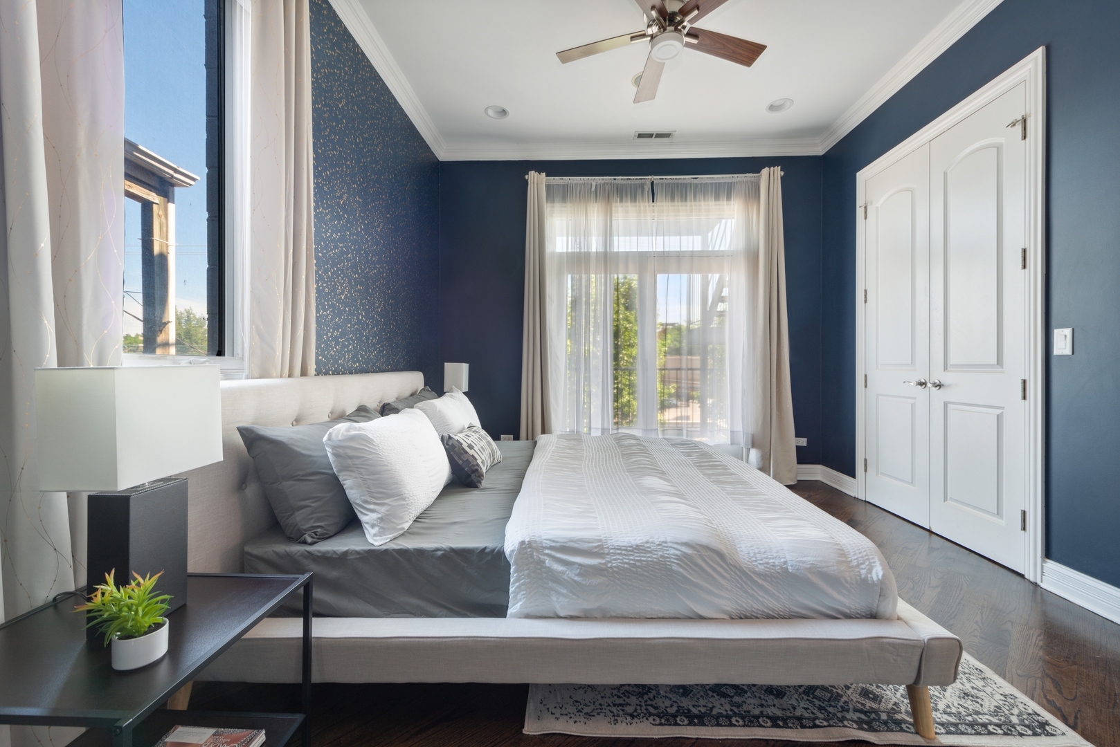 1131 West Addison Street, Unit 2 Chicago, IL 60613 - Photo 13 of 21 a bedroom with a bed table and window