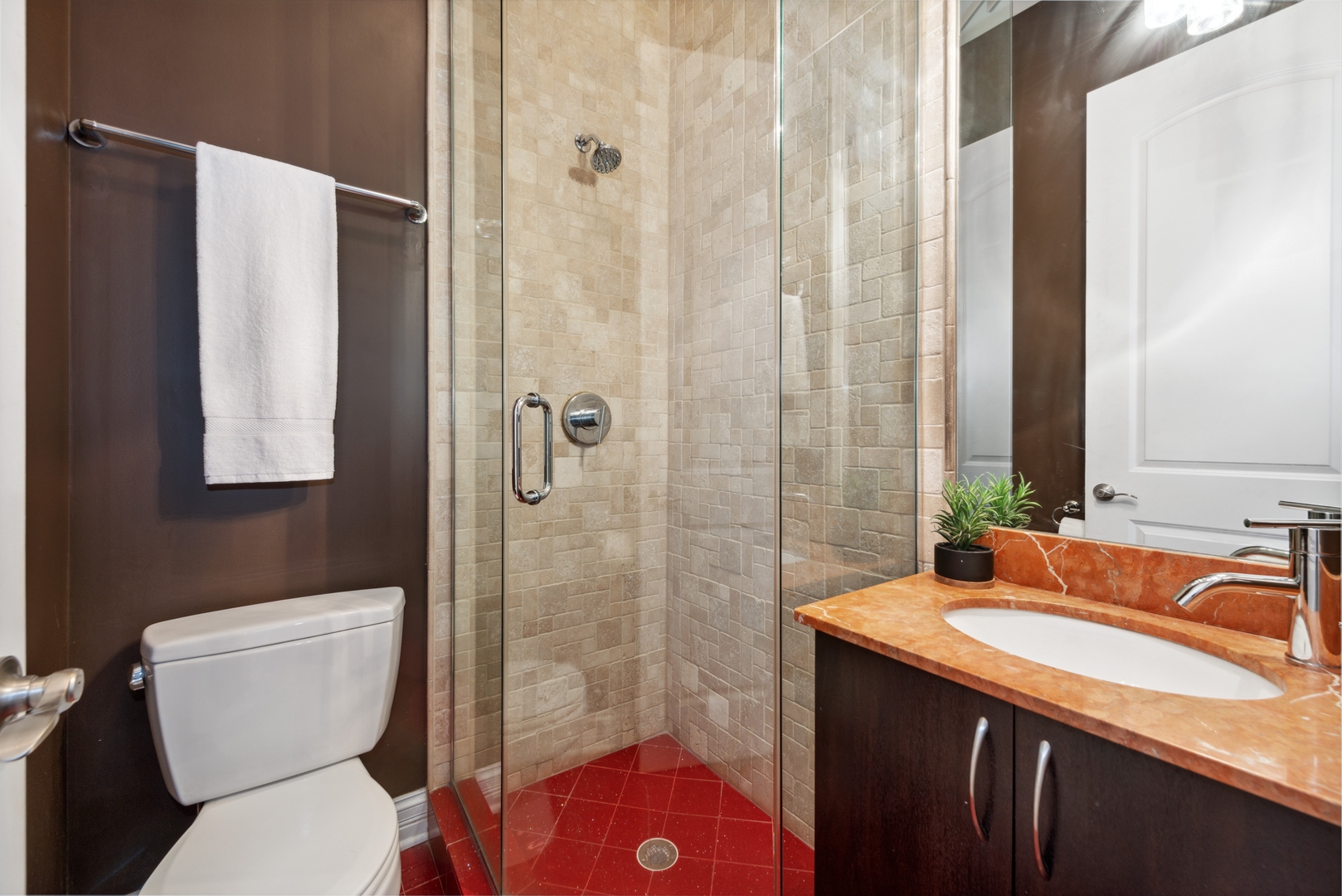 1131 West Addison Street, Unit 2 Chicago, IL 60613 - Photo 17 of 21 a bathroom with a granite countertop sink toilet and shower