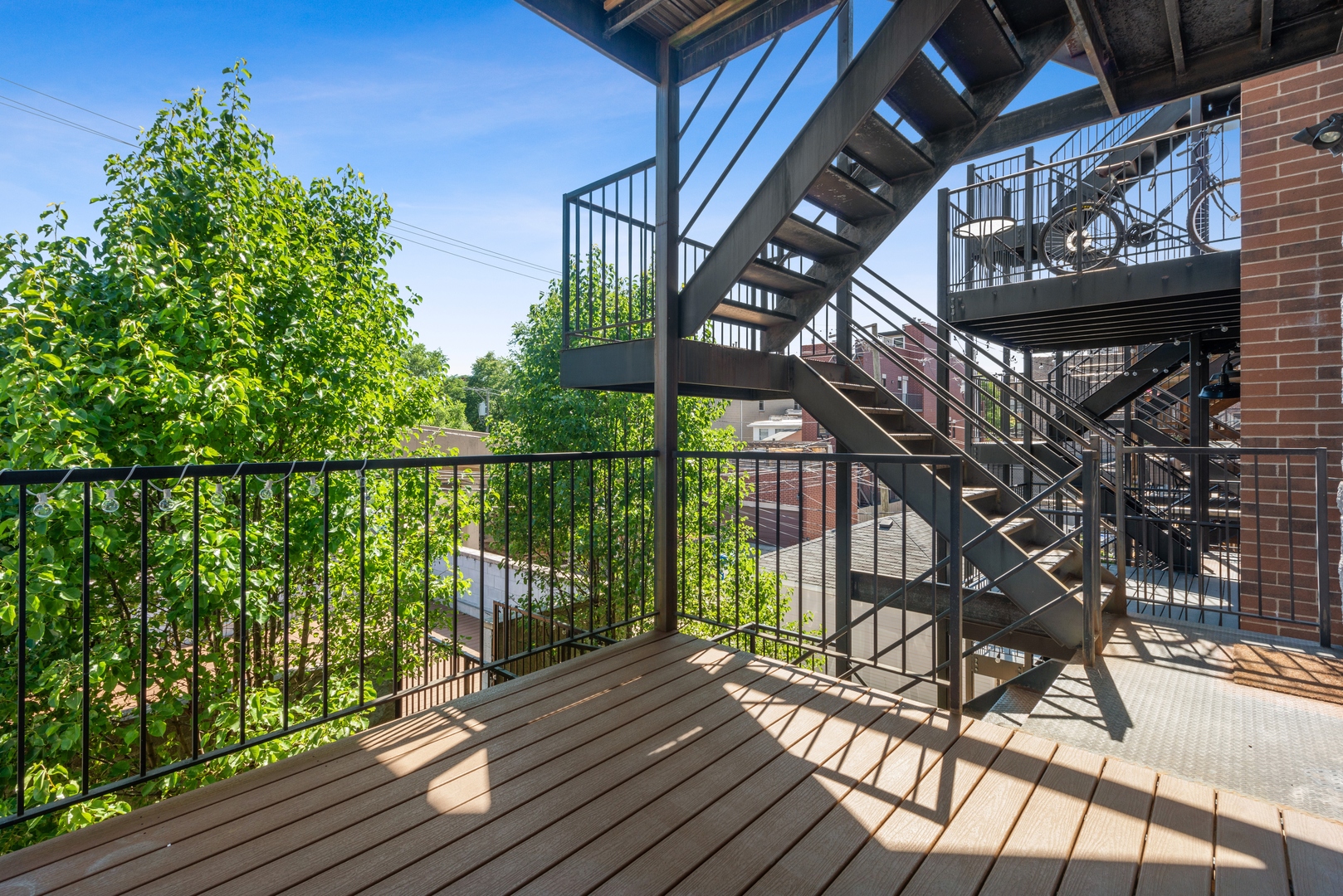 1131 West Addison Street, Unit 2 Chicago, IL 60613 - Photo 18 of 21 a view of balcony with wooden floor and outdoor seating